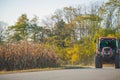 Red tractor with trailer on the road