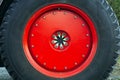 Red wheel tire tractor large metal rim Royalty Free Stock Photo