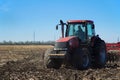 Red tractor working in the field