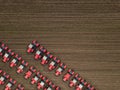 Red tractors on farmland. Aerial top down shot Royalty Free Stock Photo