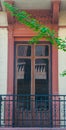 Red traditional window and balcony in Spain with stucco decoration Royalty Free Stock Photo