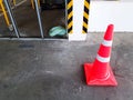 Red traffic cone on concrete floor for restricted area at construction site with copy space Royalty Free Stock Photo