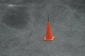 Red cone on pavement