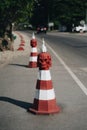 Red traffic cone with sculls near Wat Rong Khun, known as the White Temple Royalty Free Stock Photo