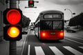 red traffic light, with bus making stop and passenger getting on or off