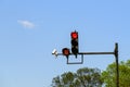 Red traffic light with digital timing countdown and traffic security camera surveillance CCTV installed on a pole above a Royalty Free Stock Photo