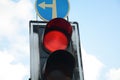 Red traffic light and Go straight or left sign. Mandatory signs. Road signs in Israel