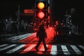 red traffic light illuminated, with person crossing the street