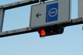 Red traffic light with letters Bus and road sign with arrow and symbol of autobus.