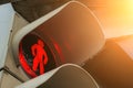 Red traffic light and the little man with a smile in the city street. Royalty Free Stock Photo