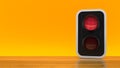 Red traffic light on orange background Royalty Free Stock Photo