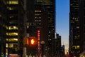 Red traffic light and Radio City Music Hall in Manhattan night Royalty Free Stock Photo