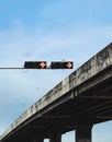 Red traffic lights and elevated bridge