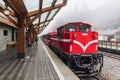 Red train on Alishan Forest Railway stop on the platform of Zhaoping railway station in Alishan, Taiwan Royalty Free Stock Photo