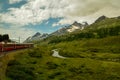 Red train through the alps in Switzerland