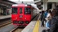 Red train approaching train station Royalty Free Stock Photo