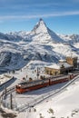 Red train Gornergrat bahn at station of Zermatt, Switzerland