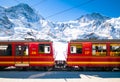 Red train of Jungfrau Bahn at Kleine Scheidegg station Royalty Free Stock Photo