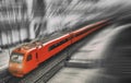 Red train on a monochrome black and white background - illustration of a processed photo. Aeroexpress. Railway, top view from the Royalty Free Stock Photo