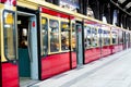 Red train on railroad station with opened doors in Berlin, Germany Royalty Free Stock Photo