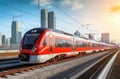 red train on a train track close to buildings Royalty Free Stock Photo