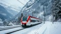 Red train travels in a valley covered by heavy snow in background on a sunny winter day Royalty Free Stock Photo