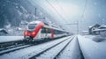 Red train travels in a valley covered by heavy snow in background on a sunny winter day Royalty Free Stock Photo