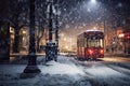 Red tram in the city at night in winter. Snowfall.