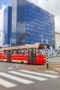 Red tram crossing the Spui square in Den Haag