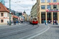 Red tram running  in the old town of  Prague, Czech Republic Royalty Free Stock Photo