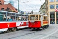 Red tram running  in the old town of  Prague, Czech Royalty Free Stock Photo