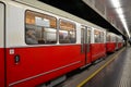 Red tram / trolley car at station: Vienna, Austria