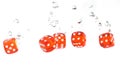 Red transparent dice falling into the water