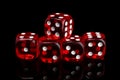 Red transparent dice for gambling on a black background