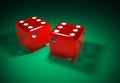 Red transparent dice on green surface