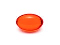 Red transparent supplement capsule on white background