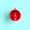 Red tree Christmas ornament in red mercury glass on blue background Royalty Free Stock Photo