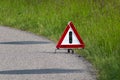 Red triangle emergency stop sign, warning of a car involved in a