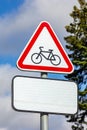 The red triangle sign prohibiting the entry of cyclists against the blue sky. Royalty Free Stock Photo