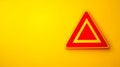 Red triangle warning sign on yellow background representing hazard Royalty Free Stock Photo
