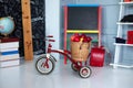 Red tricycle with basket apples. Back to school. Elementary school. Chalkboard, Books, globe in classroom. Teachers Day. Empty cla Royalty Free Stock Photo