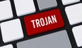 Red trojan button on computer keyboard. Concept of malicious software attack, cyber security risk and data danger Royalty Free Stock Photo