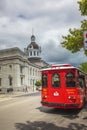 Red trolley bus in front of city hall, Kingston, Ontario, Canada Royalty Free Stock Photo
