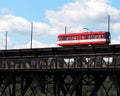 Red Trolley Car On Bridge