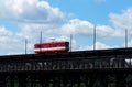 Red Trolley Car On Bridge