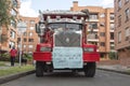 Red truck with blue sign of a colombian potatoes farmers selling into the city potatoes packages