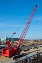 Red Truck Crane Boom With Hooks And Scale Weight Above Blue Sky