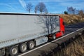 Red truck passing scenery