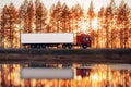 Red truck on a road at sunset Royalty Free Stock Photo