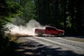 red truck speeding on a gravel forest road, dust trailing Royalty Free Stock Photo